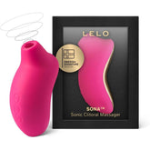 A LELO SONA Cerise - Sonic Clitoral Massager in pink, showcasing contactless Sonic Pulse technology, is positioned beside its packaging. The box emphasizes its Swedish signature design.